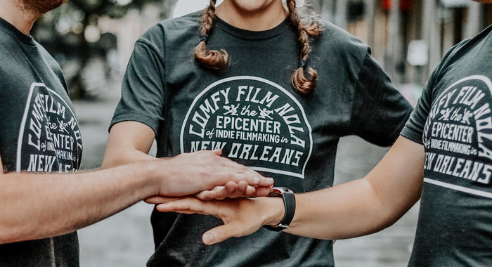 a person with braids holding hands
