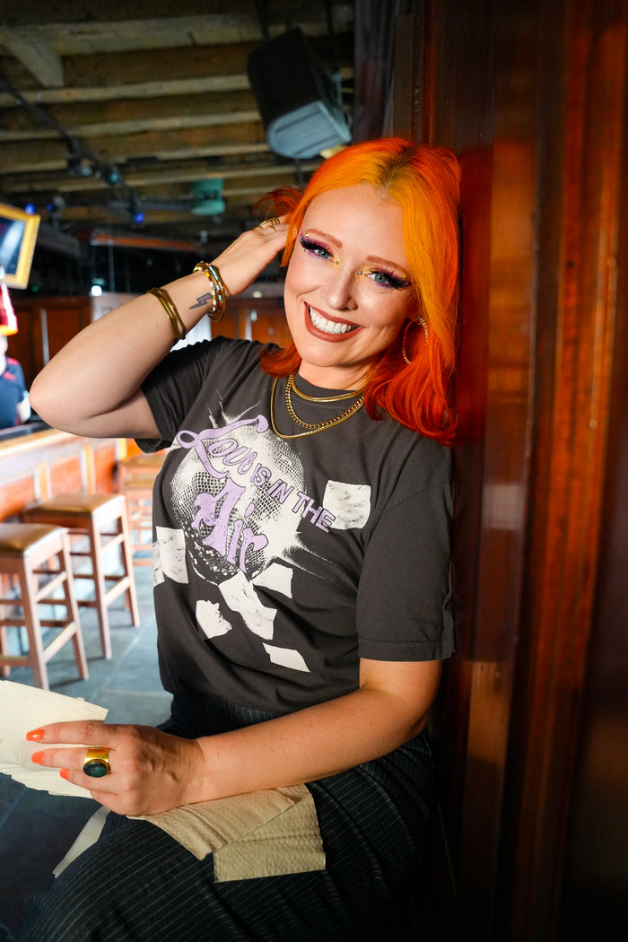 a woman smiling with orange hair
